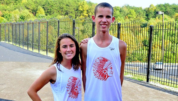 Rock Hill junior cross country runners Sarah McFann (left) and Seth Miller (right) broke school records on Saturday at the Piketon Invitational. McFann ran a 21:49 to break a 22-year-old record while Miller ran a 16:17 to snap his own record set last year. Miller has competed in nine races this fall with six wins, two runners-up and one third-place finish. He qualified for the state meet last season. (Kent Sanborn of Southern Ohio Sports Photos)