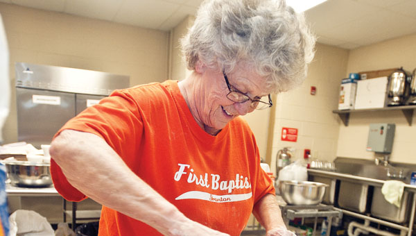 Susie Woods rolls out dough for apple dumplings at the First Baptist Church in Ironton. An estimated 600 apple dumplings will be made.