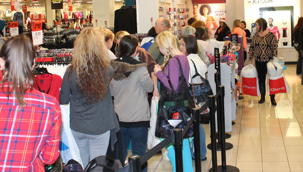 the tribune/dustin melchior People waiting in line to check out in J.C. Penney at the Ashland Town Center Mall.