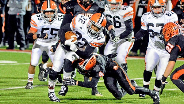 Ironton Fighting Tigers’ running back D’Angelo Palladino (22) slips past a Wheelersburg defender as he gains yardage during Saturday’s Division V Region 17 semifinal game at Portsmouth. Ironton was unable to get its offense going in the second half and lost 38-7. (Kent Sanborn of Southern Ohio Sports Photos)