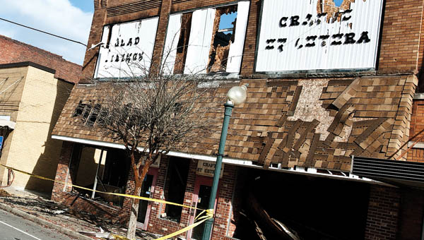 THE TRIBUNE/JESSICA ST JAMES South Third Street in downtown Ironton remains closed following Saturday evening’s fire at the former Glad Tidings bookstore.