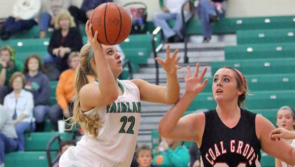 Fairland Lady Dragons’ Kelsey Riley (22) hits a short jumper in the middle of the lane as Coal Grove Lady Hornets’ Maddy McKenzie (24) runs to defend. Fairland won 62-45 on Monday in an Ohio Valley Conference game. (Kent Sanborn of Southern Ohio Sports Photos)
