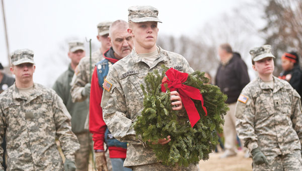 Members of the Ohio National Guard, out of Portsmouth, make their way to Lookout Point to place the final wreath during the ceremony.