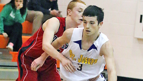St. Joseph Flyers’ guard Wulf Goheen (3) drives past the defensive efforts of a Fairview player during Tuesday’s game. The Flyers beat the Eagles 59-46. (Courtesy of Tim Gearhart of Tim’s News & Novelties of Ironton)