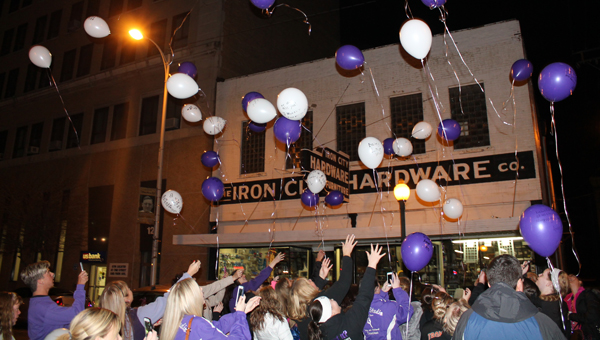Dancers, parents and instructors launch balloons outside of Cyndi’s Dance Studio on South Third Street on Monday to remember Rose Marie Rist.