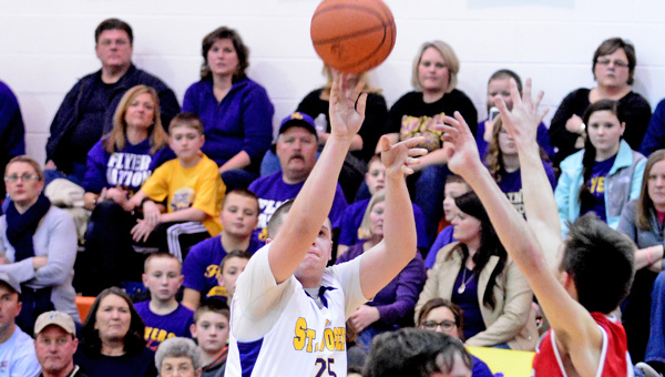 St. Joseph Flyers’ senior Zack Kelly (25) hits a 3-point goal during a 58-40 win over the New Boston Tigers on Wednesday. Kelly had 11 points to lead the Flyers’ offense. (Kent Sanborn of Southern Ohio Sports Photos)