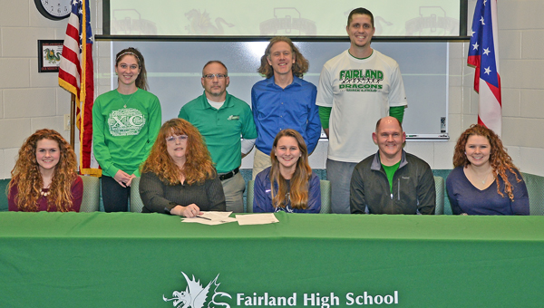 Fairland Lady Dragons’ cross country runner Jessica Price signed a letter-of-intent on Monday to attend Shawnee State University. Attending the ceremony were: seated left to right, sister Julie, mother Sherri, Jessica, father Stuart and sister Jenny; standing from left to right, Fairland assistant coach Kira Dillon, Fairland head coach Chuck Wentz, Shawnee State head coach Eric Putnam, and Fairland assistant coach Adam Alt. (Kent Sanborn of Southern Ohio Sports Photos)