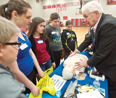 Buddy Fry, with the Lawrence County Emergency Medical Services, shows off equipment medics and paramedics use while in on the job.