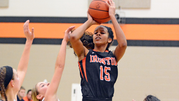 Ironton Lady Fighting Tigers’ Lexie Barrier (15) hits a jump shot over Wheelersburg defenders during Monday’s game. Barrier had 21 points in a 51-49 loss. (Kent Sanborn of Southern Ohio Sports Photos)