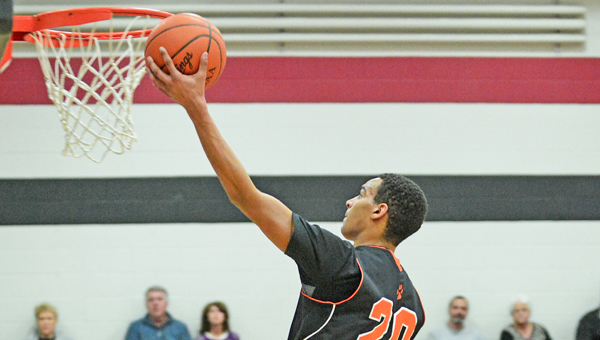 Ironton Fighting Tigers’ Dylan Malone goes high in the air to lay in two points during a recent Ohio Valley Conference game. Malone and Ironton battled past the Fairland Dragons 57-54 in overtime on Friday to finish the regular season 13-9. (Kent Sanborn of Southern Ohio Sports Photos)
