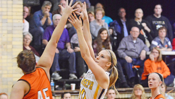 St. Joseph Female Flyers’ senior Amber Neal (10) puts up a shot and scores the 1,000th point of her career in a 73-58 win over the Raceland Lady Rams on Monday. (Kent Sanborn of Southern Ohio Sports Photos)