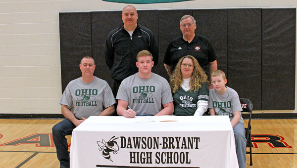 Coal Grove Hornets’ senior lineman Austen Pleasants signed a national letter of intent Wednesday with the Ohio Bobcats. Attending the ceremony were: seated from left to right, father Michael Wilburn, Austen, mother Jennifer Pleasants and brother Arik; standing from left to right, Coal Grove assistant coach Jay Lucas and head coach Dave Lucas. (Kent Sanborn of Southern Ohio Sports Photos)