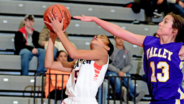 Ironton Lady Fighting Tigers’ Lexi Wise (5) makes a layup during a 63-29 rout of the Lucasville Valley Lady Indians on Sunday in the Division III sectional finals. (Kent Sanborn of Southern Ohio Sports Photos)