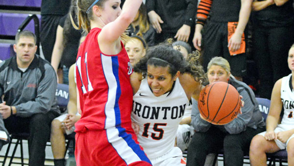Ironton Lady Fighting Tigers’ Lexie Barrier (right) drives around Fort Frye’s Alexis Enochs during Wednesday’s Division III regional tournament semifinal game. Ironton lost 36-26. (Kent Sanborn of Southern Ohio Sports Photos)
