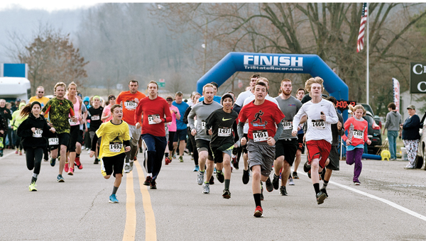 At the starting line, 5K participants take off Saturday morning during the Lawrence County Board of Developmental Disabilities 5K run/walk for awareness.