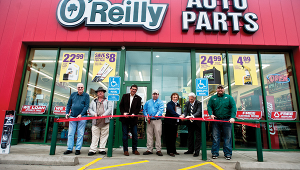 THE TRIBUNE/JESSICA ST JAMES Members of the community welcome O’Reilly Auto Parts on Wednesday morning. Pictured left to right, South Point Mayor Ron West, Lawrence County Treasurer Stephen Dale Burcham, Fayette Trustee Perry Brock, manager J.R. Fields, Shirley Dyer and Bill Dingus, with the Lawrence County Chamber of Commerce and assistant manager Jacob Wells.