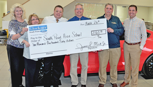 Glockner Ford of South Point made a donation of $2,160 to the South Point High School athletic department. Pictured from left to right are: Glockner Ford employees Marji Thomas and Debbie Ramey, general manager J.L. Mick, South Point principal Ben Coleman, South Point athletic director Dave Adams, and dealership president Tim Glockner. (Kent Sanborn of Southern Ohio Sports Photos)