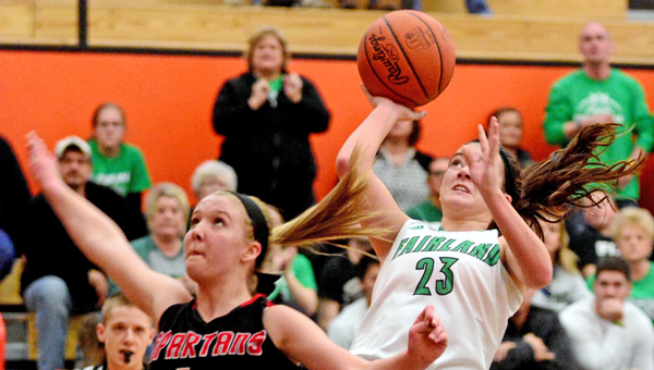 Fairland Lady Dragons’ Caitlin Stone (23) shoots a jump shot over Alexander’s Leah Richardson (4) after making a steal during Friday’s Division III district championship game. Fairland beat Alexander 42-38 for its fourth straight district title. (Kent Sanborn of Southern Ohio Sports Photos)