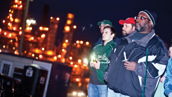 Members of USW Local 8-719 gather outside the Marathon Petroleum refinery in Catlettsburg as they take part in a vigil marking the 10 year anniversary of the Texas City Refinery explosion. The refinery workers have been on strike for almost seven weeks, citing safety issues.