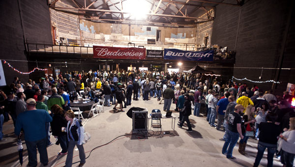 Beer enthusiasts gather inside the Ro-Na Theater on Saturday for the Great River Craft Brew Fest in downtown Ironton.