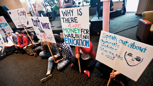 A “live protest” is staged during Protest Through Art and Music portion of the 2015 Kennedy Lecture Series Wednesday at Ohio University Southern.