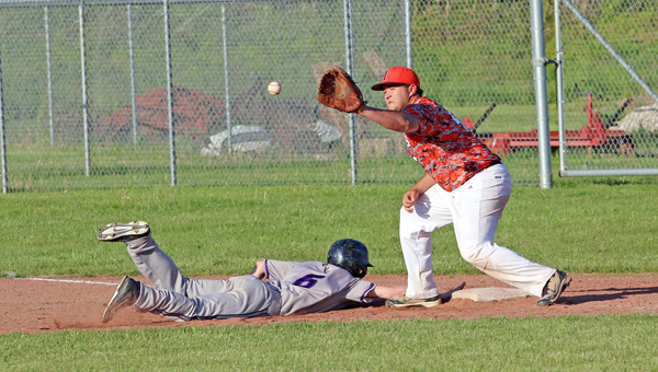 Chesapeake Panthers’ Alex Miller (6) dives back into first base ahead of the throw to Ironton Fighting Tigers’ first baseman Hunter Klaiber. Chesapeake won 5-3. (Courtesy of Tim Gearhart of Tim’s News & Novelties of Ironton)