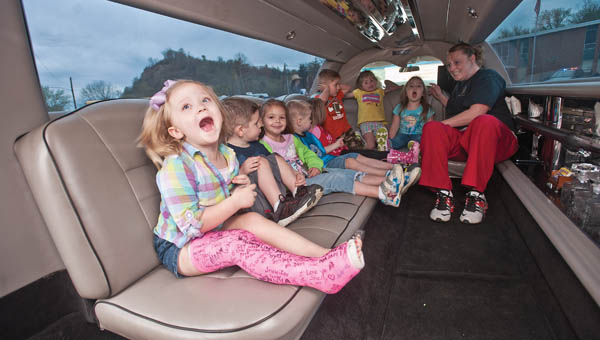 Students from the Ohio University Southern Development Center, in Hanging Rock, take a seat inside a limousine.
