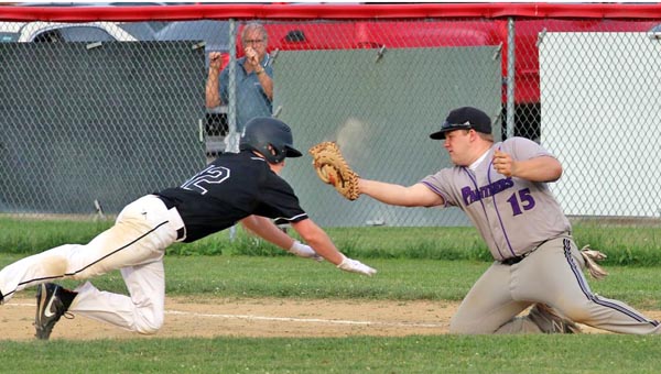 Coal Grove Hornets’ baserunner Sean Paulus dives back into first base as Chesapeake Panthers’ first baseman Dakota Blankenship looks to make the tag. Chesapeake edged Coal Grove 2-1 in nine innings on Tuesday to win the Ohio Valley Conference baseball title outright. (Kent Sanborn of Southern Ohio Sports Photos)