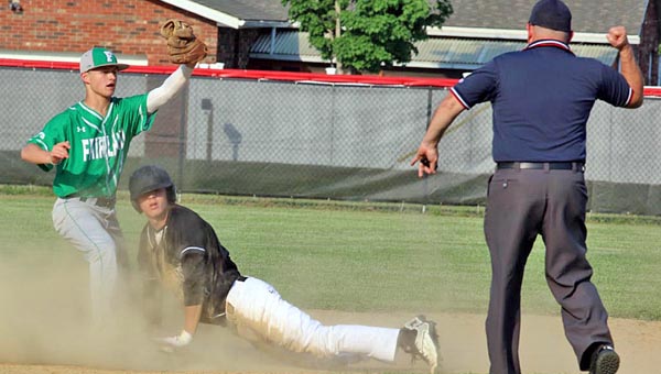 Tim Gearhart of Tim’s News & Novelties, Park Ave. in Ironton Fairland Dragons’ Trace Adkins (left) shows his glove with the ball to the umpire who signals that Coal Grove Hornets’ baserunner Daniel Rutherford is out at second base. Coal Grove won 5-0.