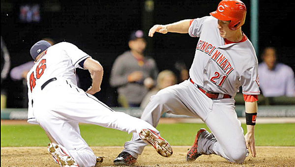 Cincinnati Reds' Todd Frazier scores on a wild pitch during the ninth inning of Friday's game. Frazier's run wasn't enough as the Reds lost their sixth straight game in a 7-3 loss to the Cleveland Indians. (Courtesy of The Cincinnati Reds.com)