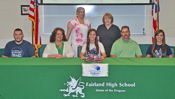 Fairland Lady Dragons’ senior Emmy Fulks signed a letter-of-intent to run cross country and track at Shawnee State University. Attending the signing ceremony were: seated from left to right, brother Clay Fulks, mother Doreen Fulks, Emmy, father Frank Fulks, and twin sister Elly Fulks; standing from left to right, aunt Tara Landers and grandmother Glenda Dillon. (Kent Sanborn of Southern Ohio Sports Photos)