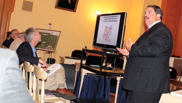 Lawrence County Engineer and co-chairman of the Lawrence County Transportation Committee, Doug Cade, goes over the updated plans and proposals regarding certain roads and intersections in the county Tuesday at the statehouse in Columbus.