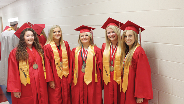 Symmes Valley High School graduate honor students Cheryl Crawford, Autumn Keathley, Brenna Morris, Sarah Crabtree and Amber Bryant pose for a picture before the graduation ceremony on Sunday.