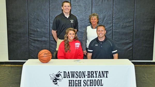 Coal Grove Lady Hornets senior basketball standout Jacy Jones signed with Otterbein University on Friday. Attending the signing ceremony were: seated from left to right, Jacy and Coal Grove head ooach Rick Roach; standing from left to right, brother Jeb and mother Janet. (Kent Sanborn of Southern Ohio Sports Photos)