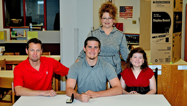 Coal Grove Hornets’ senior quarterback Jesse Rigsby signed a letter-of-intent with Denison University on Wednesday. Attending the ceremony are: seated from left to right, father Jere Rigsby, Jesse, and sister Jeri Leigh Rigsby; standing is his mother Rachael Rigsby. (Kent Sanborn of Southern Ohio Sports Photos)