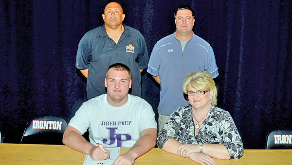 Ironton Fighting Tigers senior lineman Isaac Sherman signed with Jireh Preparatory Academy on Friday in order to prepare for college football. Attending the signing ceremony were: seated left to right, Isaac and mother Bethanie Sherman; standing left to right, Ironton athletic director and basketball coach Mark LaFon and Ironton head football coach Mark Vass. (Kent Sanborn of Southern Ohio Sports Photos)