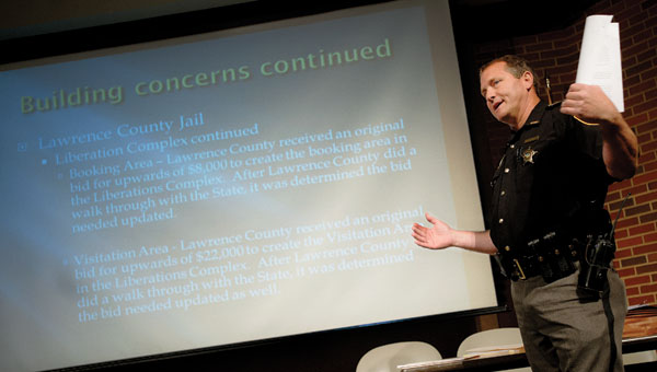 Lawrence County Sheriff Jeff Lawless addresses a crowd, including those from Columbus and Scioto County during a town meeting.