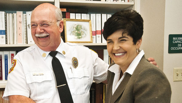 Chief Tom Runyon, of the Ironton Fire Department, with Katrina Keith during his retirement party celebration Tuesday. Runyon has served with Ironton for over 28 years.