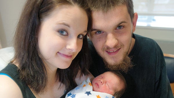 Amanda and Cody Ingels with their newborn son Tyson while at Cabell Huntington Hospital. Tyson’s mother delivered him at the family home in Pedro.