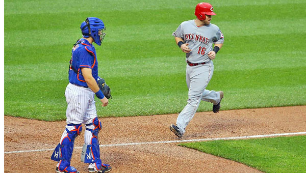 Cincinnati Reds’ catcher Tucker Barnhart (16) scores on a double by Brandon Phillips in the fifth inning of Saturday’s game. The Reds and New York Mets were tied 1-1 when the game was suspended. (Courtesy of The Cincinnati Reds.com)