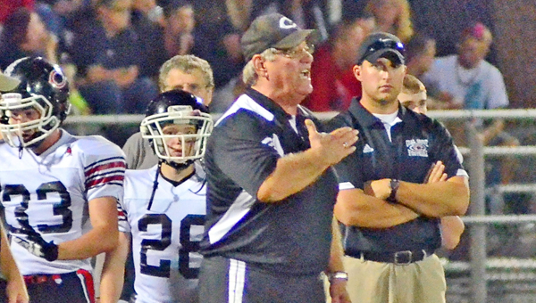 Former Coal Grove Hornets’ head football coach Dave Lucas is shown signaling the defense to his team. (Kent Sanborn of Southern Ohio Sports Photos)