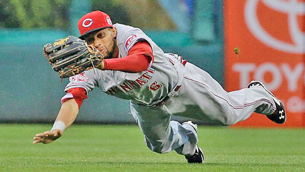Cincinnati Reds’ centerfielder Billy Hamilton makes a diving catch in the first inning of a line drive hit by Philadelphia’s Ben Revere. The Phillies rallied to beat the Reds 5-4. (Courtesy of The Cincinnati Reds.com)