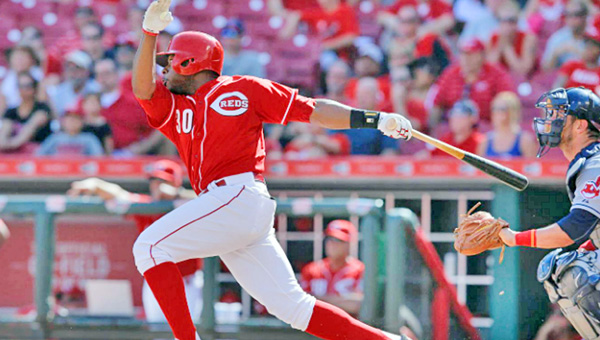 Cincinnati’s Jason Bourgeois singles to drive in Eugenio Suarez in the ninth inning to tie the game at 3-3 and send it into extra innings. However, the Reds gave up two runs in the 11th inning as they lost 5-3 to the Cleveland Indians on Sunday. (Courtesy of the Cincinnati Reds.com)