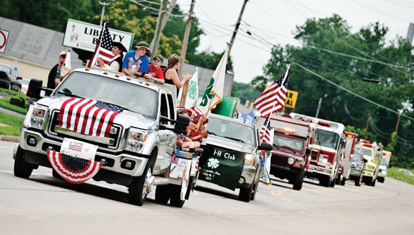 The Getaway Go-Getters 4-H Club cheer during the Lawrence County Fair Parade Sunday in Proctorville.