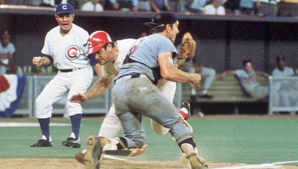 Cincinnati Reds’ great Pete Rose runs over Cleveland Indians’ catcher Ray Fosse to score the winning run in the 1970 All-Star Game to give the National League a 5-4 win in the 12th inning. The game was held at Riverfront Stadium in Cincinnati. (Courtesy of The Cincinnati Reds.com)