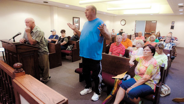Cliff Back addresses Ironton City Council members during a public hearing Thursday about the rezoning of the former Whitwell Elementary School. Surrounding neighbors are not in favor of the rezoning.
