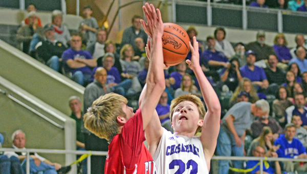 Chesapeake Panthers’ senior guard Gage Rhoades (right) goes high in the air to score during last season’s district tournament. Rhoades will play this season despite heart surgery. (Kent Sanborn of Southern Ohio Sports Photos)