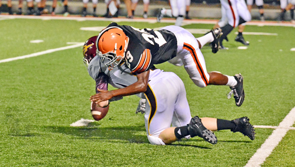 Ironton Fighting Tigers’ Isaiah Brick-Scott (29) breaks up a pass attempt during last week’s game against Russell. Ironton hosts Kentucky’s No. 1-ranked Class A perennial power Beechwood this Friday. (Kent Sanborn of Southern Ohio Sports Photos)