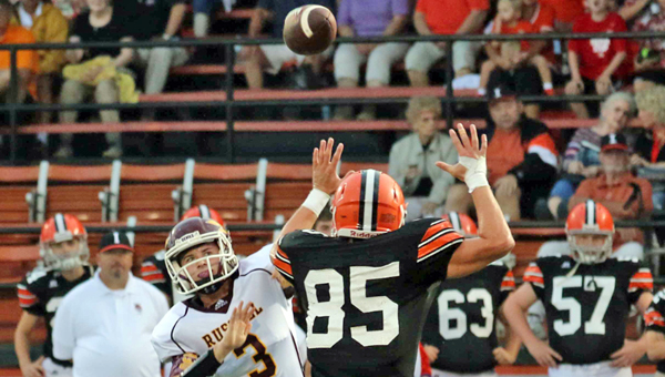 Ironton Fighting Tigers' defensive end Lucas Campbell (85) applies pressure on Russell quarterback Jacob McKee (3). The game was postponed due to the weather and will be played at 8 p.m. on Saturday.