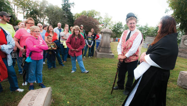 Patrick Terkhorn, left, and Dawnya Boggs, right, plays the characters Halsey Clark Burr and Harriett Kingsbury Burr during the annual Historical Walk Saturday at Woodland Cemetery.